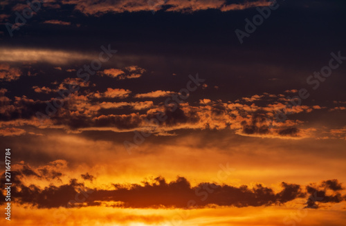 Beautiful sunset with clouds and sun background © IonelV