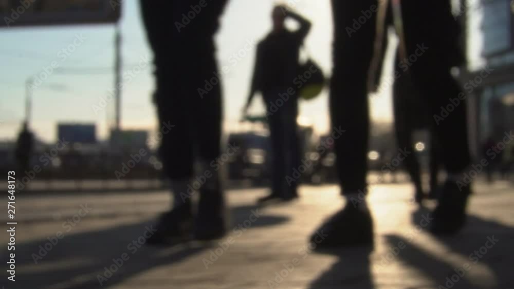People walk through the city. Slow motion. Blurred Background People walk through the city. Slow motion. Blurred Background