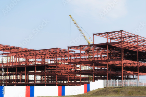 Industrial construction workers-crane and frame construction.