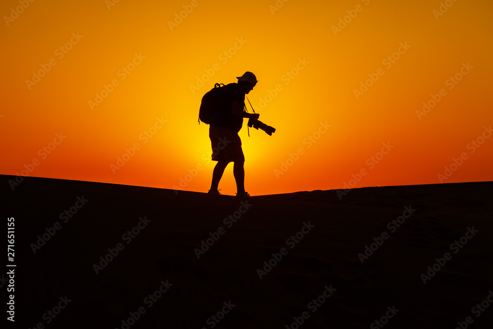 Desert and man at sunset