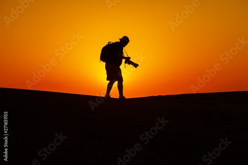 Desert and man at sunset