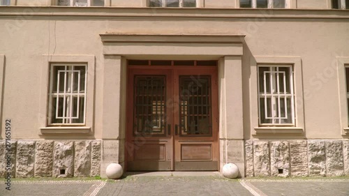 Large double wooden doors with glass at the entrance to the building. Postmodernism , modernism. The building is faced with masonry. USSR