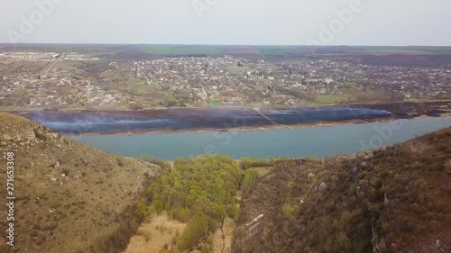 Wallpaper Mural Arial view over the river and small village. Spring fires. Dniester river of Moldova republic. Torontodigital.ca