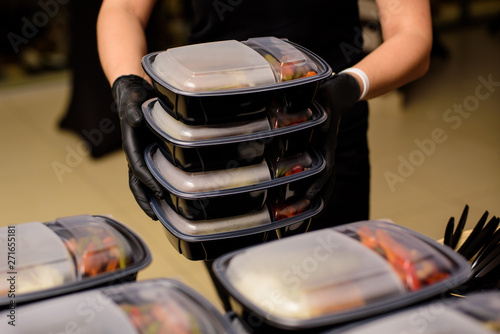 Lunch box with food in the hands. Catering