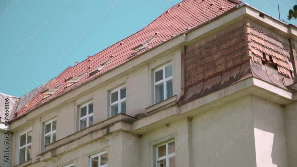Residential apartment building . Postmodernism , modernism. Soviet construction. Multi-storey building in the city. The background is trees and blue sky. Uzhgorod.