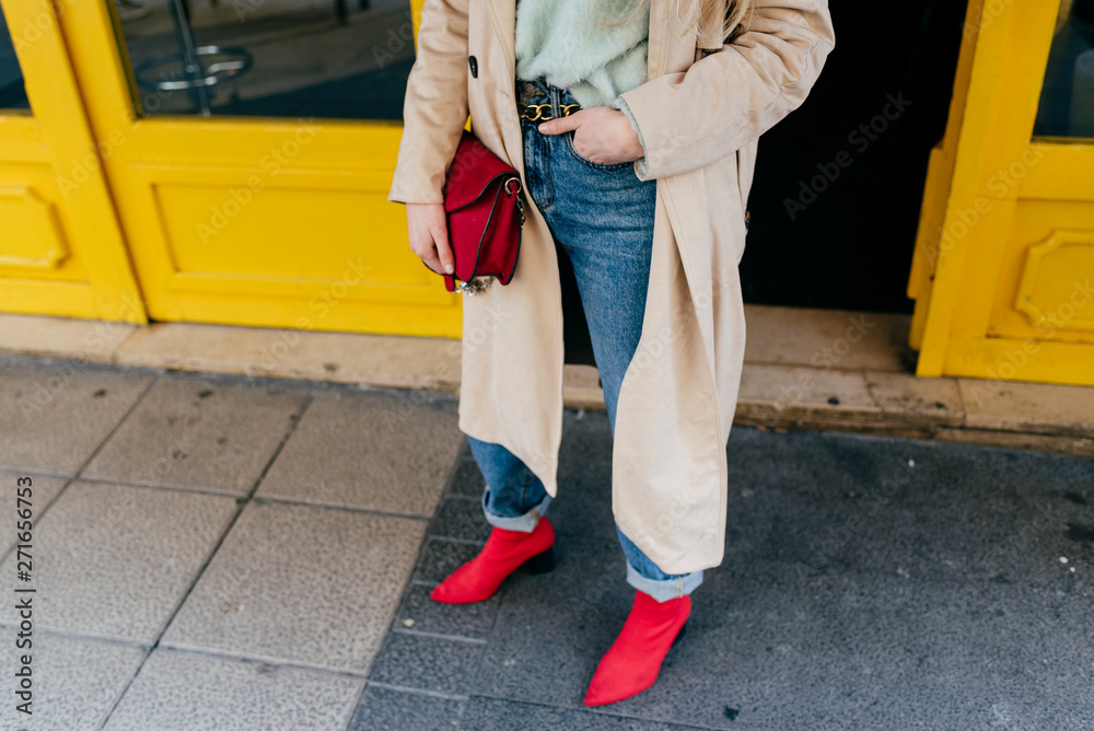 Young stylish woman standing on street Young stylish woman standing on street