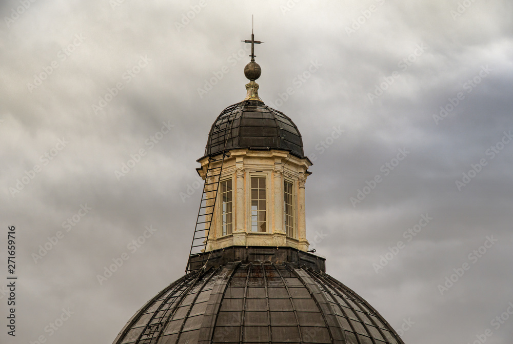 Close up of the dome (15th century) of the Cathedral of St Lawrence in the historic centre of Genoa, with a stormy sky background in a rainy day, Liguria, Italy