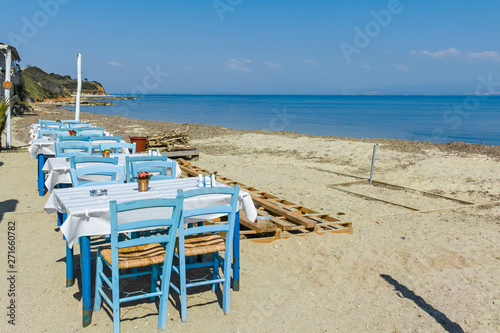 Typical Greek restaurant at the beach of Nea Fokea, Kassandra, Chalkidiki, Central Macedonia, Greece © hdesislava