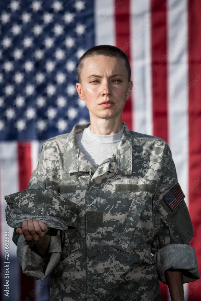 Female US Army Soldier in front of usa flag Female US Army Soldier in front of usa flag