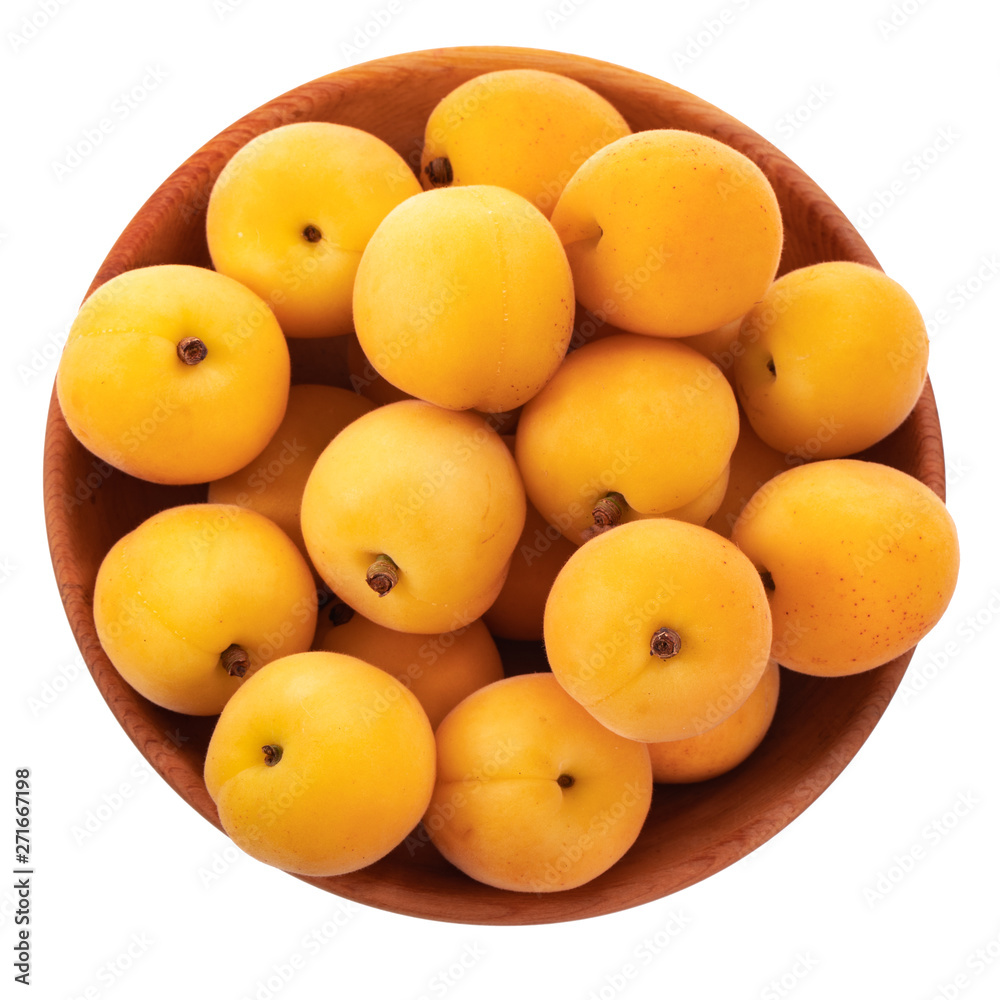 heap of orange apricots in wooden plate isolated on white background. top view heap of orange apricots in wooden plate isolated on white background. top view