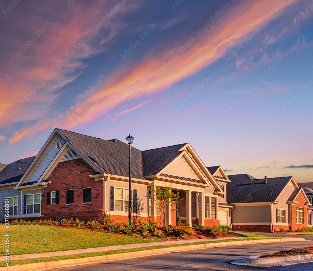 Sunrise Over New Homes in a Surburban Subdivision Sunrise Over New Homes in a Surburban Subdivision
