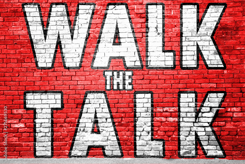 Walk the Talk Graffiti on Brick Wall