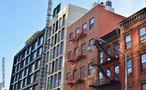 New Condo Development Bowery Street New York City Gentrification of Old Neighborhood Immigrant Tenement Apartments