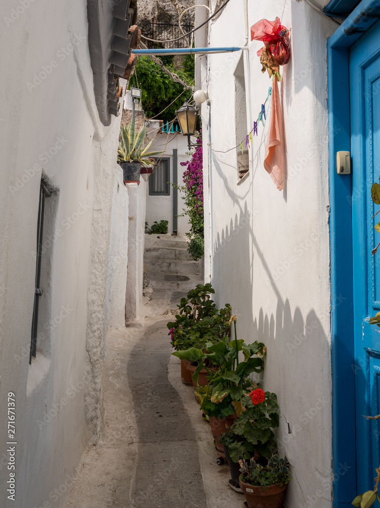 Fototapeta premium Narrow steps in ancient neighborhood of Anafiotika in Athens by the Acropolis