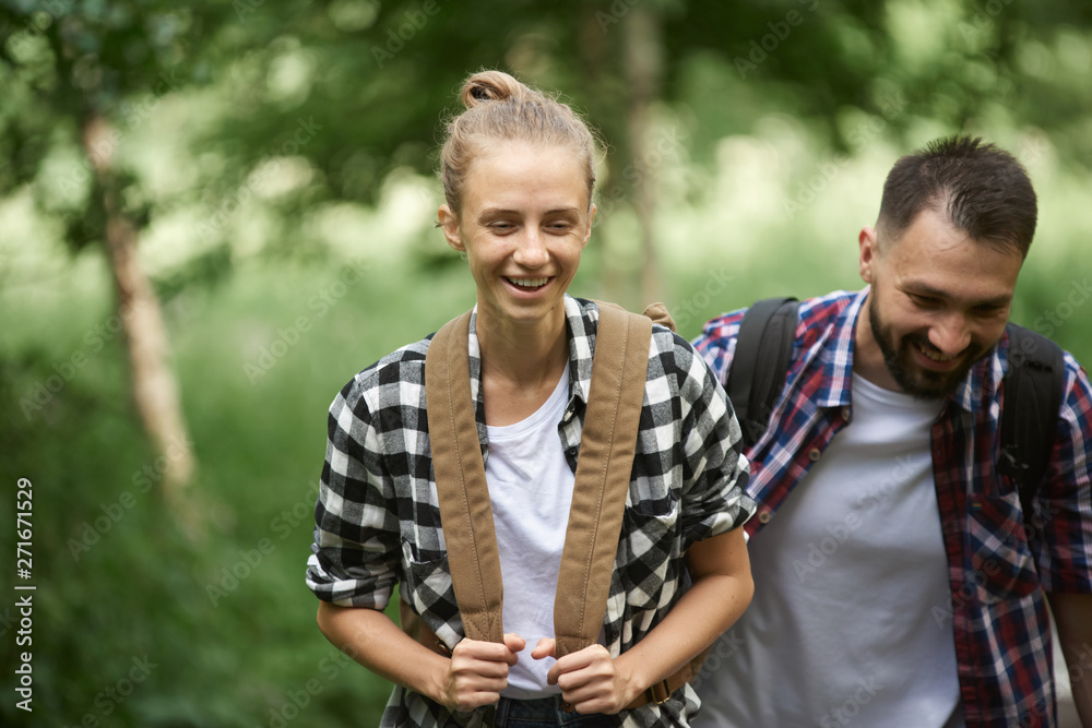 Fototapeta premium Couple hiking in the forest