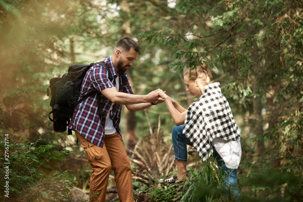 Fototapeta premium Couple hiking in the forest