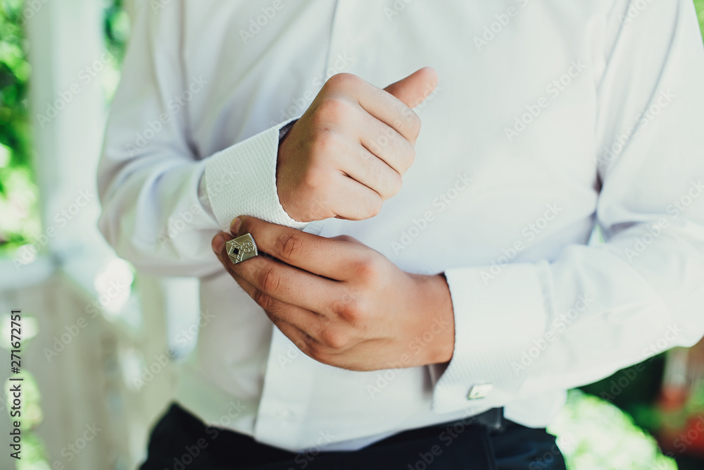 business man buttoning his shirt business man buttoning his shirt