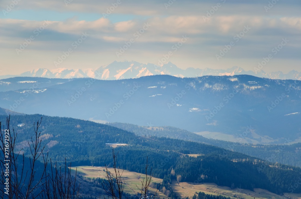 Fototapeta premium Beautiful spring mountain landscape. A rural view of the Polish Tatras and valleys from the surrounding mountains.