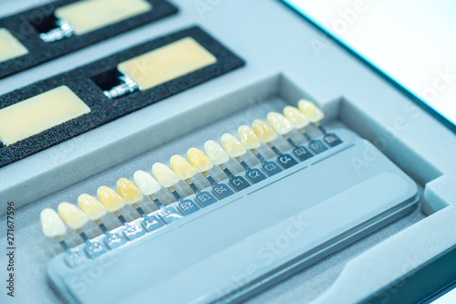 Denture. Color scale for the selection of shades of teeth. The definition of the color of tooth enamel. Set of colors of dental implants. Equipment for dental modeling. Dentistry. © Grispb