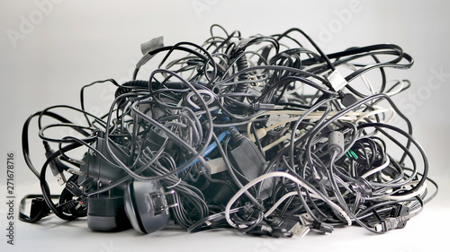 A low angle shot of  a large bundle of used multi-colored electronic cords and cables to be recycled for copper, brass, and other valuable metals.