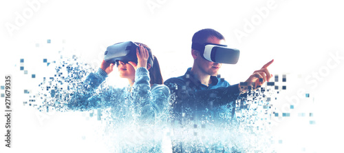 Obraz na płótnie A man and a woman in glasses of virtual reality. The concept of modern technologies and technologies of the future. Fragmented by pixels. VR glasses. w salonie