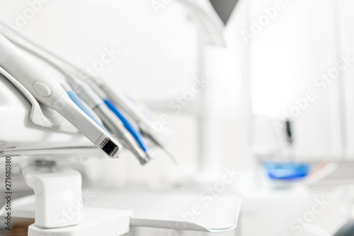 Stomatological instrument in the dentists clinic. Dental work in clinic. Operation  tooth replacement. Medicine  health  stomatology concept. Office where dentist conducts inspection and concludes.