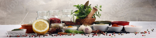 Spices and herbs on table. ...