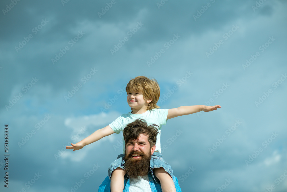 Father and son playing together. Child sits on the shoulders of his father. Family Time. Father and son playing together. Child sits on the shoulders of his father. Family Time.