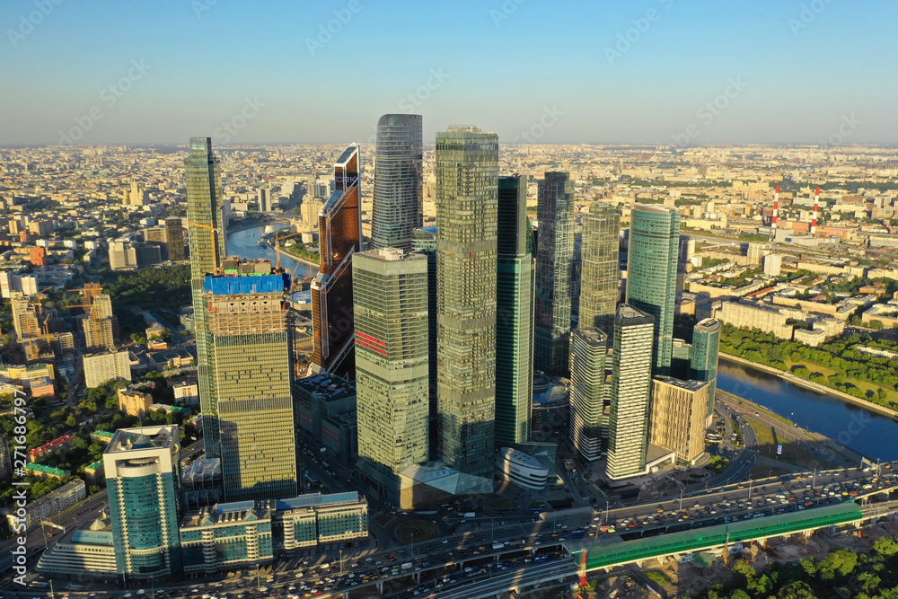 Aerial view of the skyscrapers of the business center of Moscow and highway at sunset