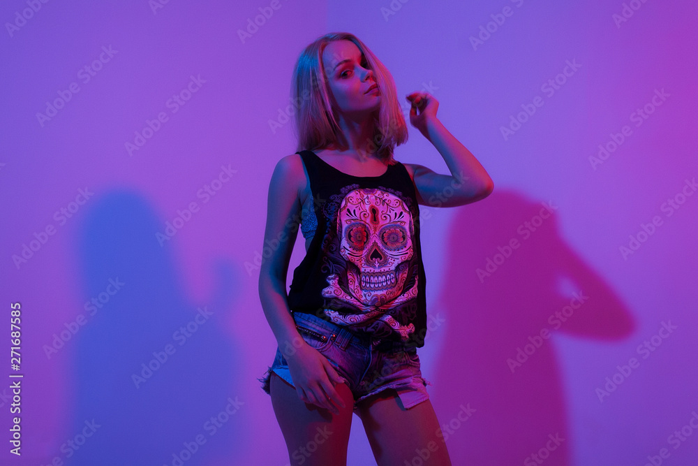 young teen girl in red blue purple light