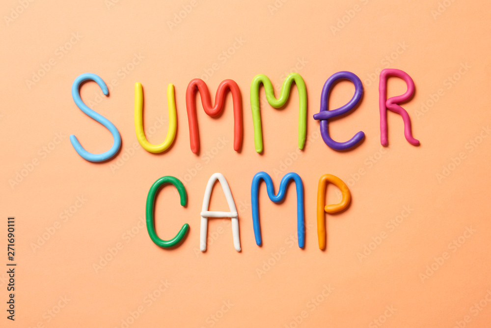 Text SUMMER CAMP made of modelling clay on color background, flat lay Text SUMMER CAMP made of modelling clay on color background, flat lay