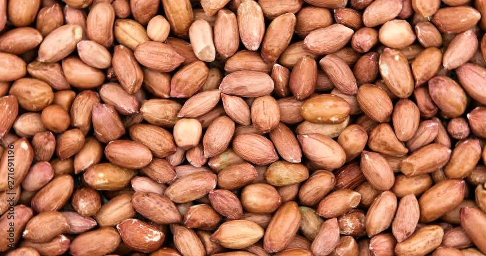 Close up of unpeeled peanuts. Food background Close up of unpeeled peanuts. Food background