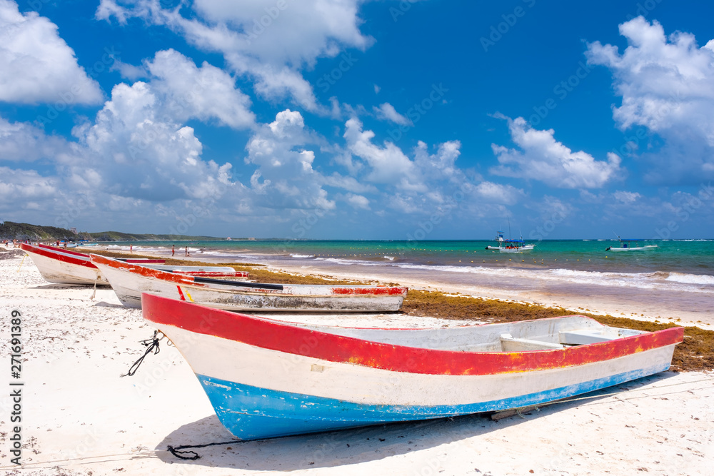 Fishing boats at the beach next to Tulum on the Mayan Riviera Fishing boats at the beach next to Tulum on the Mayan Riviera