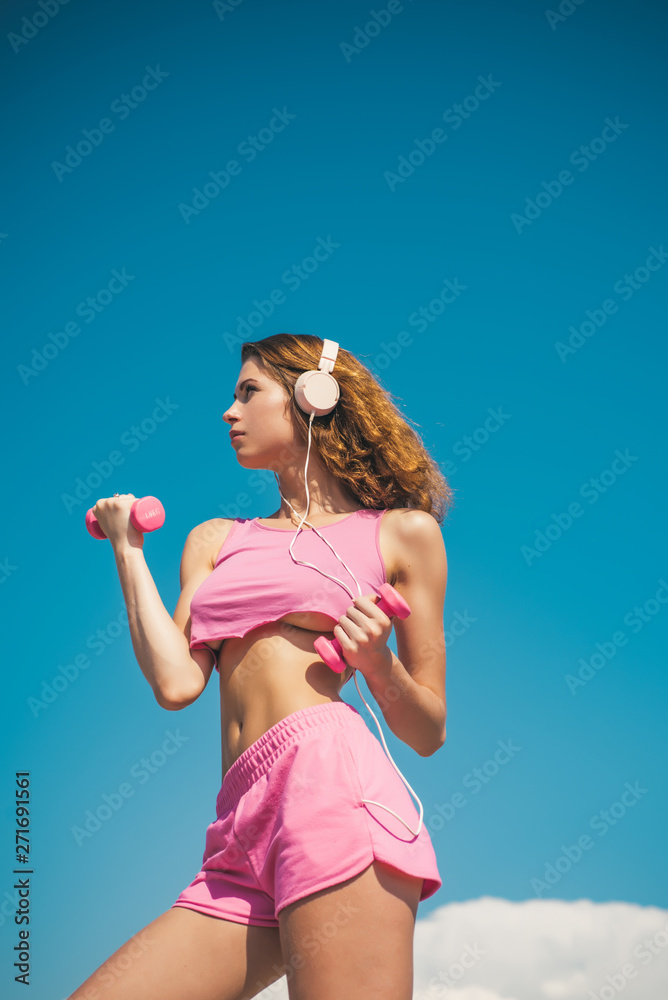 Start daily workout. Sexy slim active woman with straight beautiful body in  sportswear outdoor blue sky background. Regular workout. Health care.  Fitness lifestyle. Favorite sport. Workout result foto de Stock | Adobe