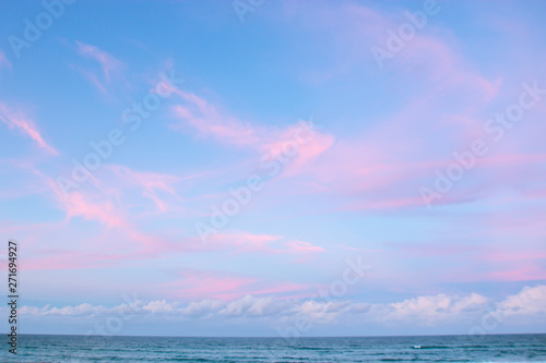 pretty pastel colour sky pink purple blue with fluffy cloud on beach with white sand Australia Gold Coast © QuickStartProjects