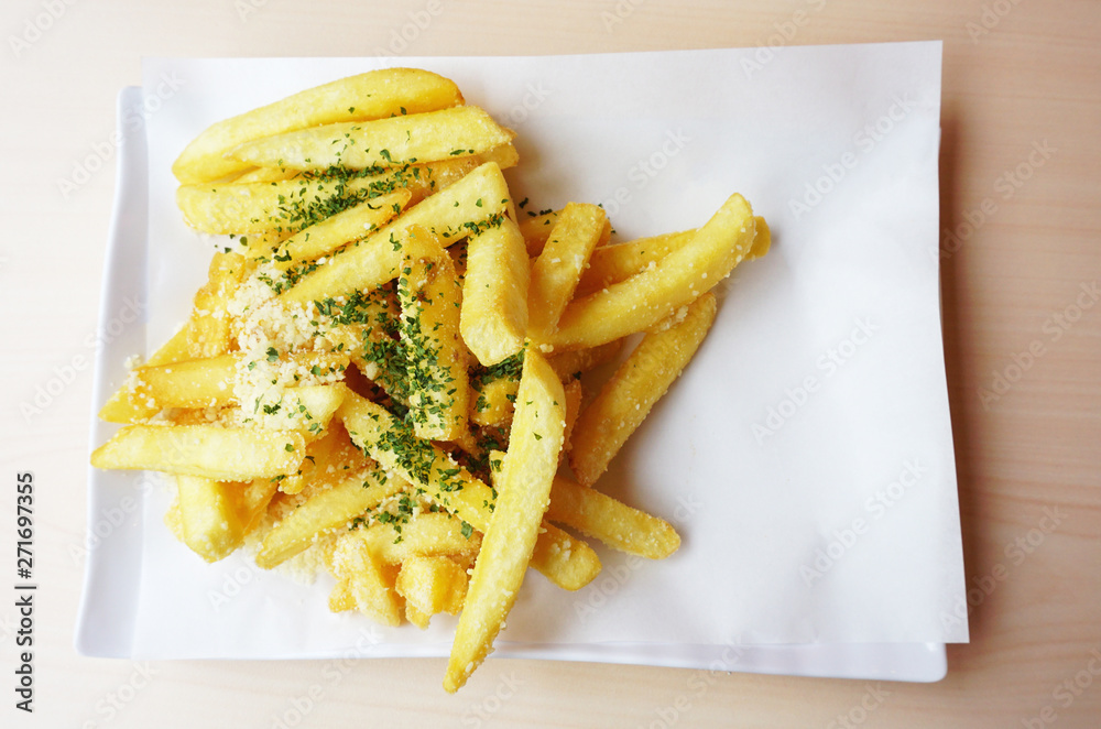 French Fries topped chocolate and mayonnaise in a white dish on white background, Close up.. French Fries topped chocolate and mayonnaise in a white dish on white background, Close up..