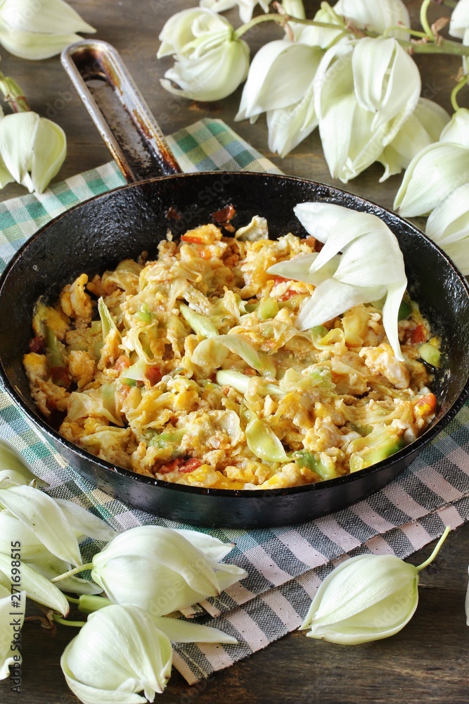 Yucca flowers dish. flower petals fried with eggs and tomatoes. national cuisine of Costa Rica