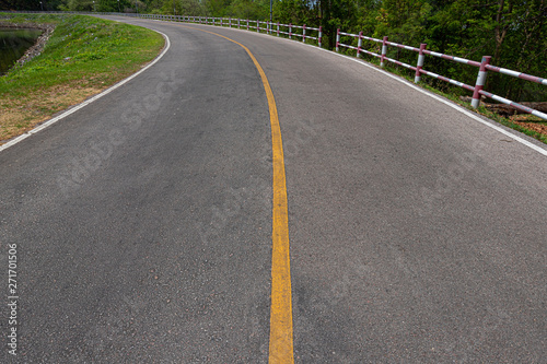 Rural road with stiles marking lines white stripes texture Background.