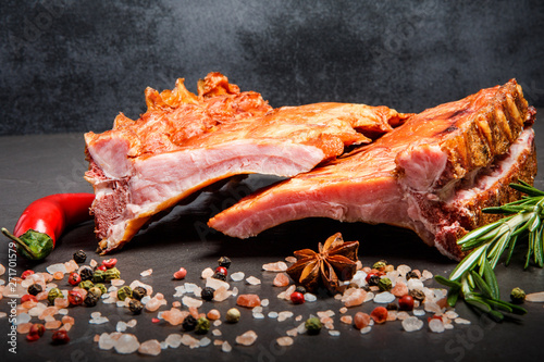 macro smoked ribs with spices, rosemary and chili pepper