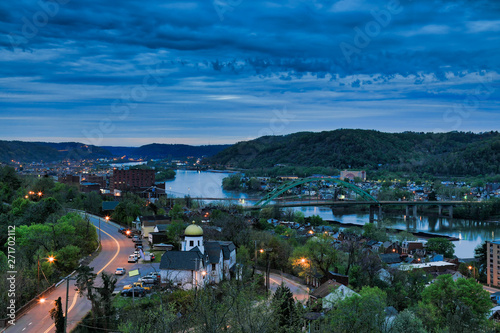This is an aerial view of Wheeling, West Virginia along the Ohio River.  This skyline cityscape shows Wheeling Island in the distance. © aceshot