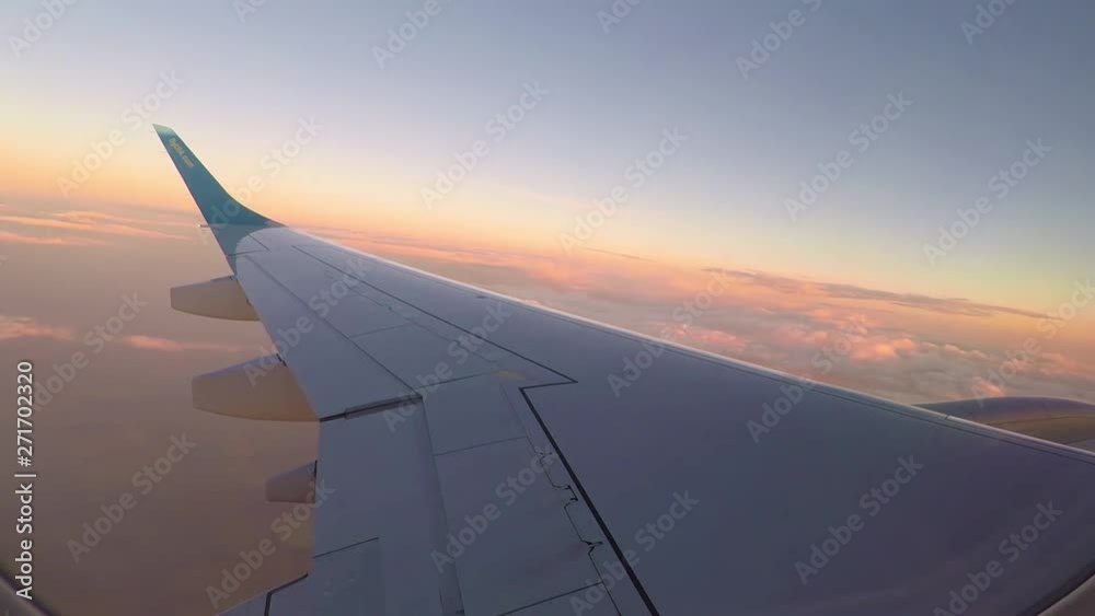 Airplane in flight time lapse above clouds at sunset. Airplane in flight time lapse above clouds at sunset.