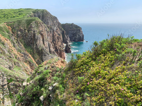 The rocky shore of the island of Shkot  in spring. Russia, Vladivostok photo