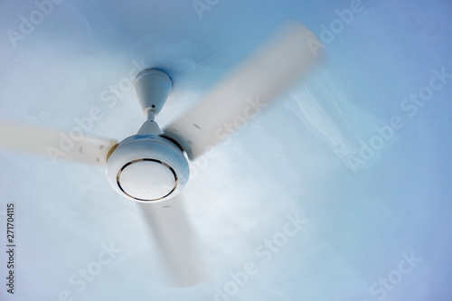 White ceiling fan on a white ceiling