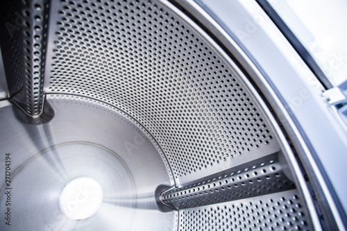 Close up photo of inside washing machine drum © sarunyu