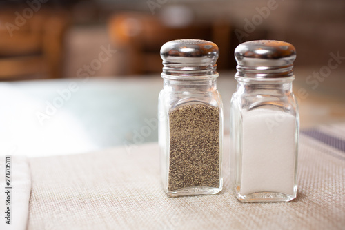 A salt and pepper shaker in a restaurant setting