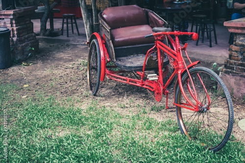 The old three wheeled bicycle red.