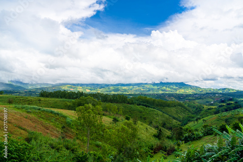 Blue sky high peak mountains fog hills mist scenery national park views at Phu Tub Berk, Khao Koh, Phetchabun Province, Thailand