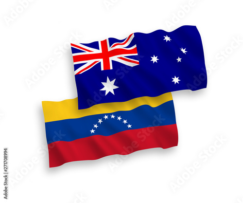 National vector fabric wave flags of Australia and Venezuela isolated on white background. 1 to 2 proportion.
