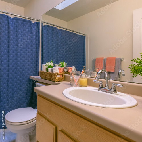 Frame Square Interior of a small and cozy bathroom with a single vanity unit and toilet