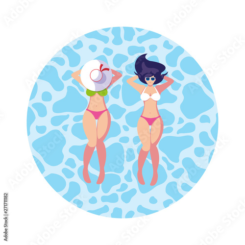 beautiful girls couple with swimsuits floating in water